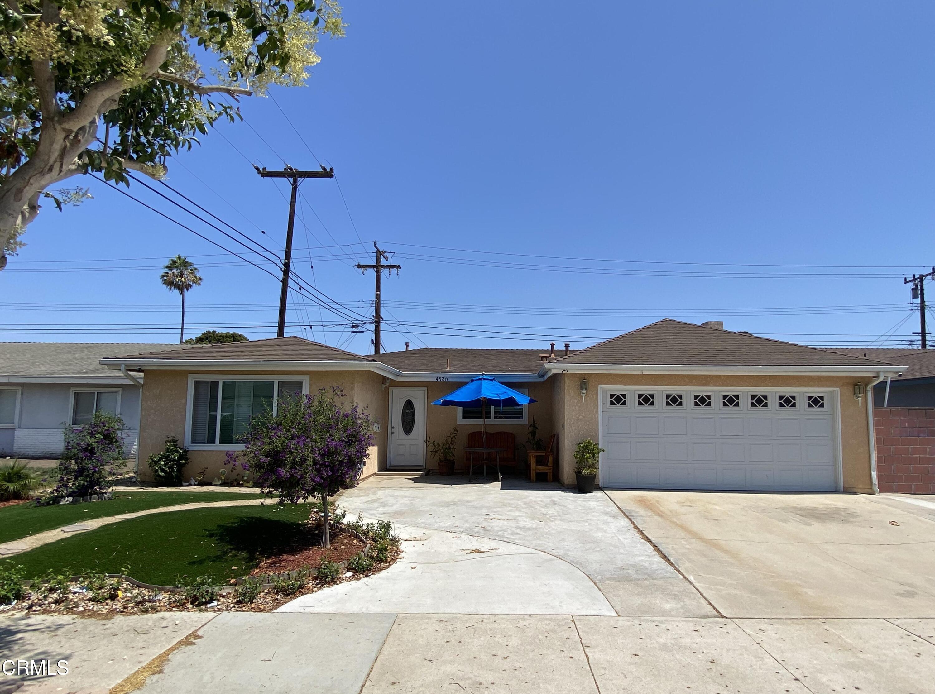 4520 Reeder Avenue Oxnard, CA 93033 - Photo 2 of 28 a front view of a house with a garden