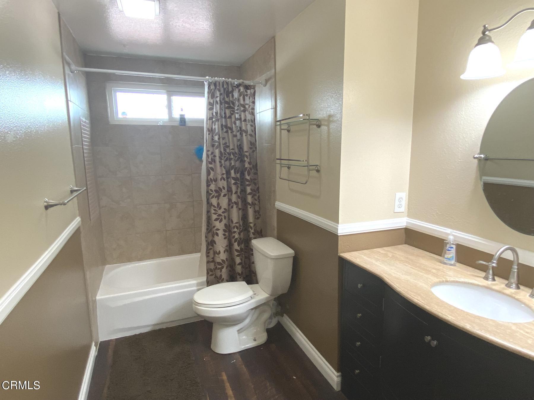 4520 Reeder Avenue Oxnard, CA 93033 - Photo 17 of 28 a bathroom with a sink toilet and shower