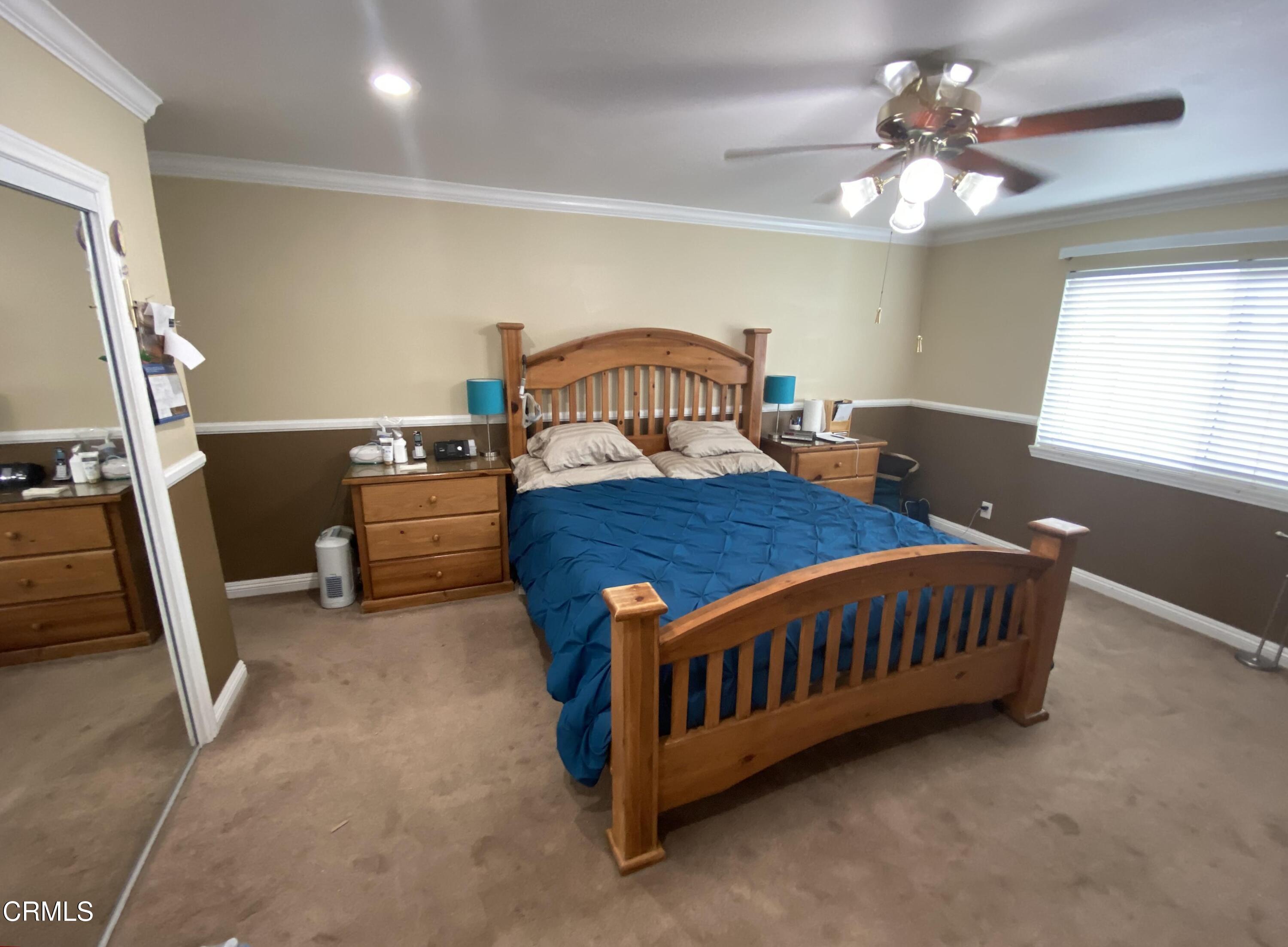 4520 Reeder Avenue Oxnard, CA 93033 - Photo 18 of 28 a blue bed sitting in a room next to a window