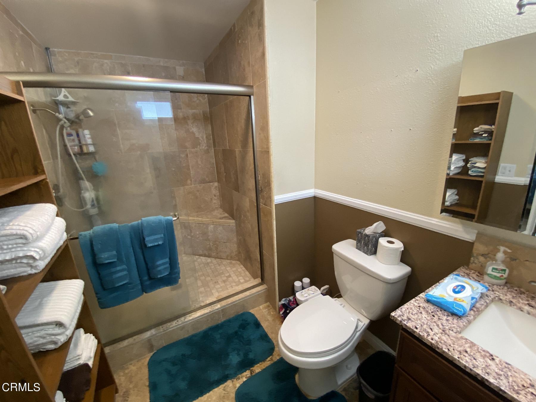 4520 Reeder Avenue Oxnard, CA 93033 - Photo 20 of 28 a bathroom with a granite countertop toilet and a bathtub