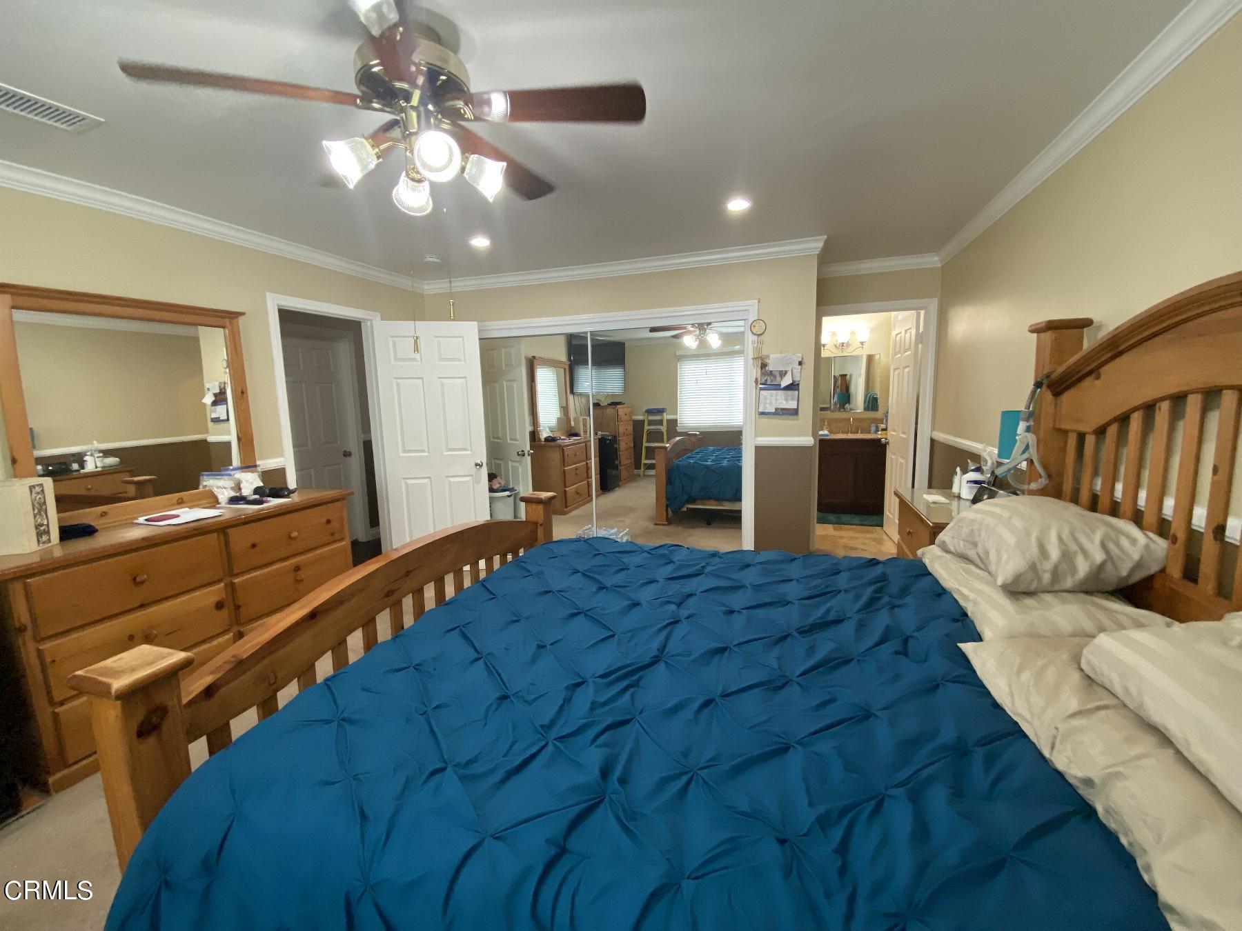 4520 Reeder Avenue Oxnard, CA 93033 - Photo 21 of 28 a bed room with a bed furniture and kitchen view