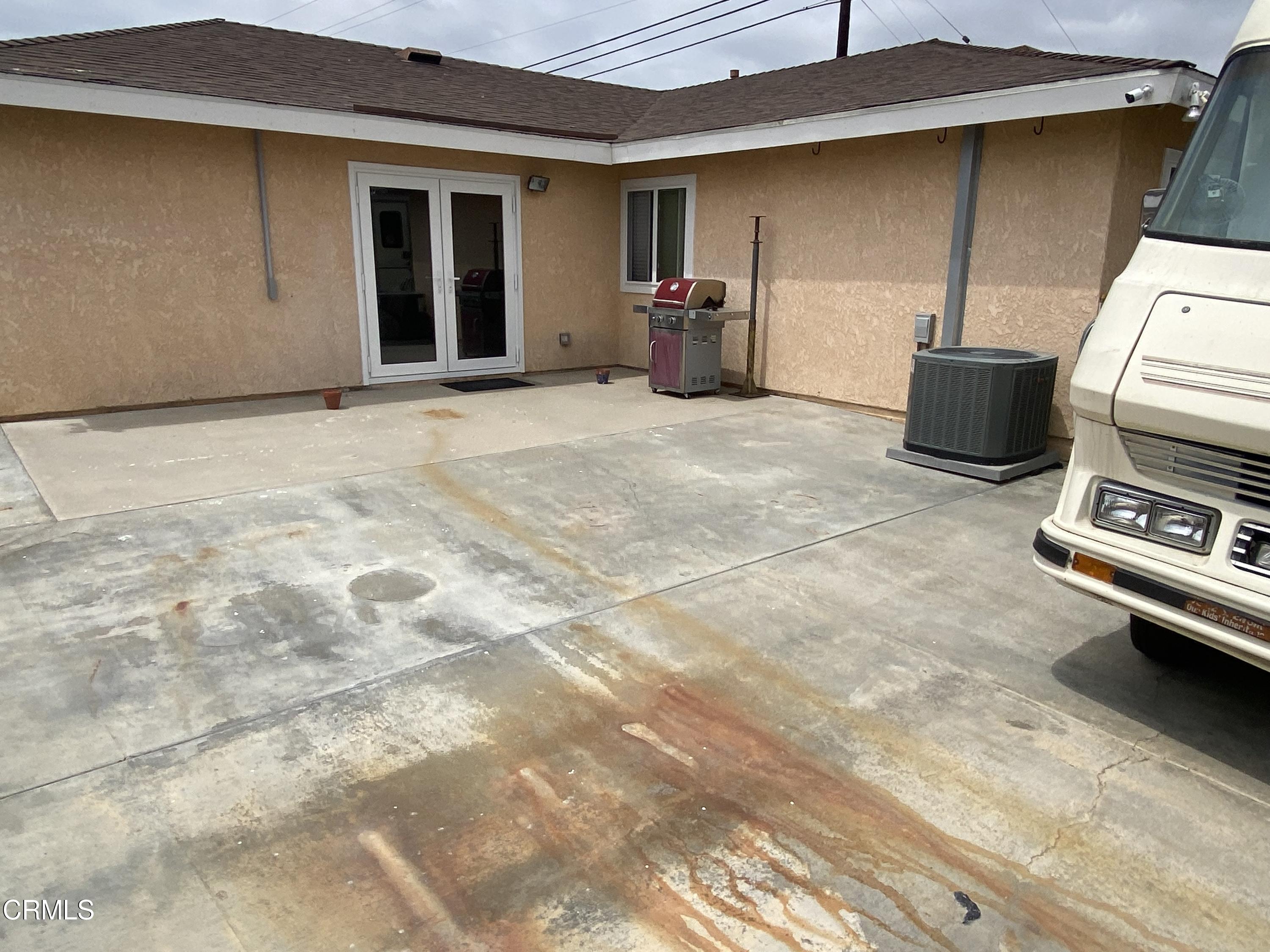 4520 Reeder Avenue Oxnard, CA 93033 - Photo 23 of 28 a view of a patio with table and chairs