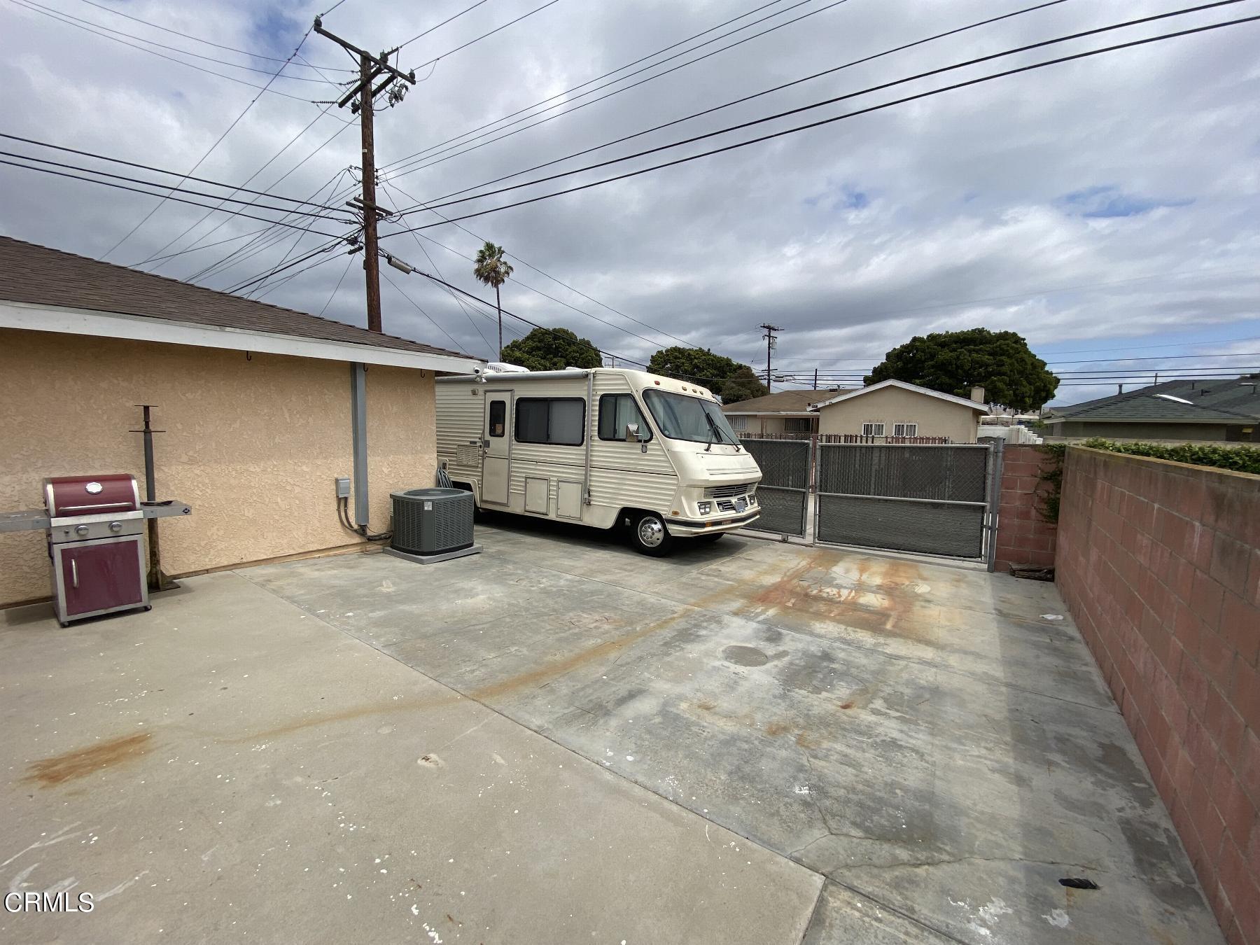 4520 Reeder Avenue Oxnard, CA 93033 - Photo 25 of 28 a car parked in a parking lot of a house
