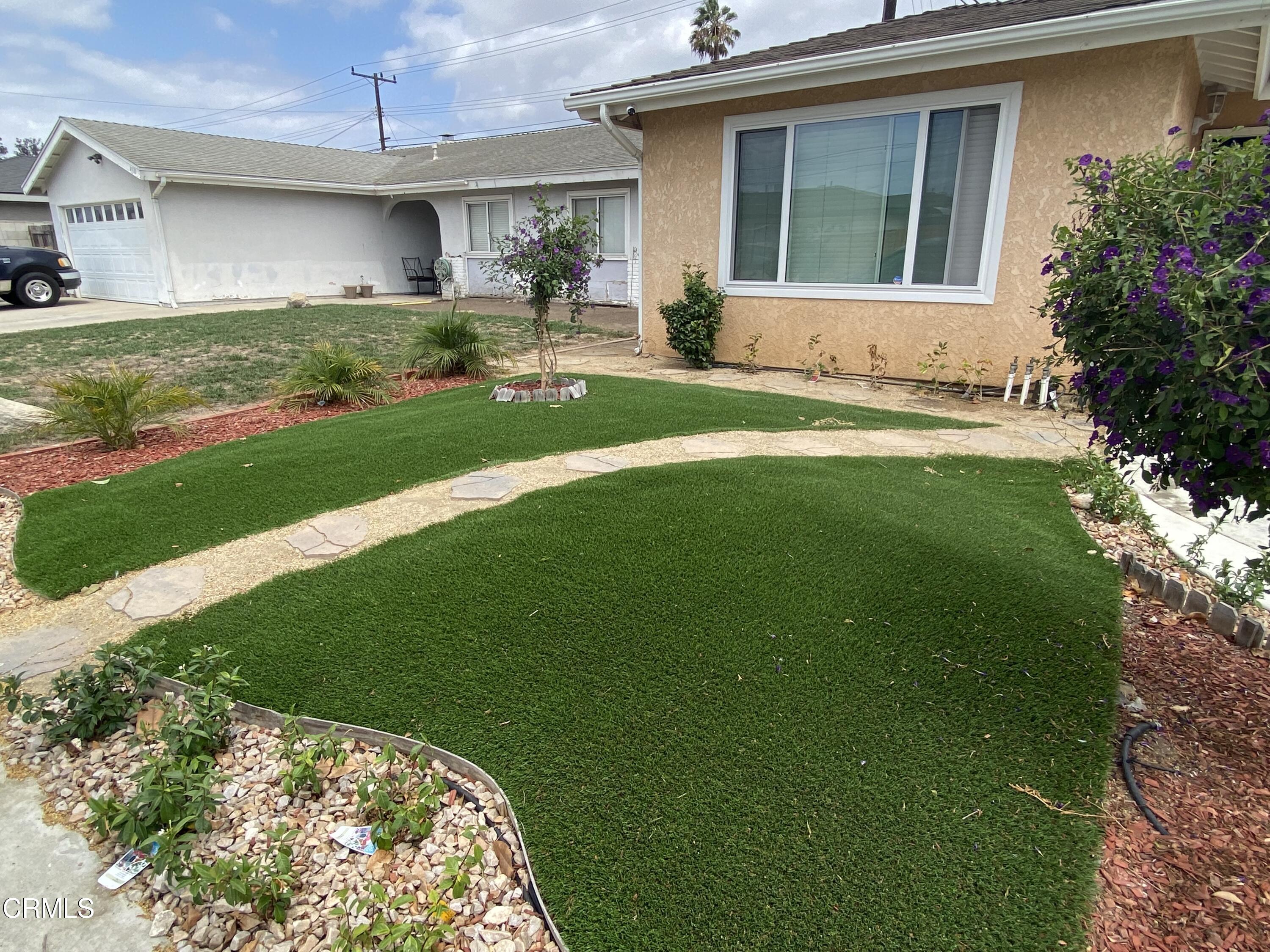 4520 Reeder Avenue Oxnard, CA 93033 - Photo 26 of 28 a view of a house with a garden