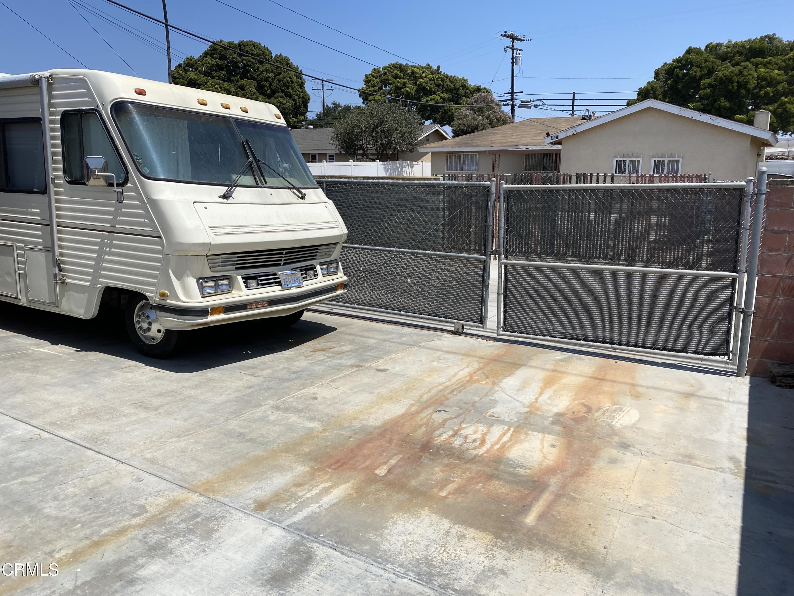 4520 Reeder Avenue Oxnard, CA 93033 - Photo 28 of 28 a view of a white house with a sink and a yard