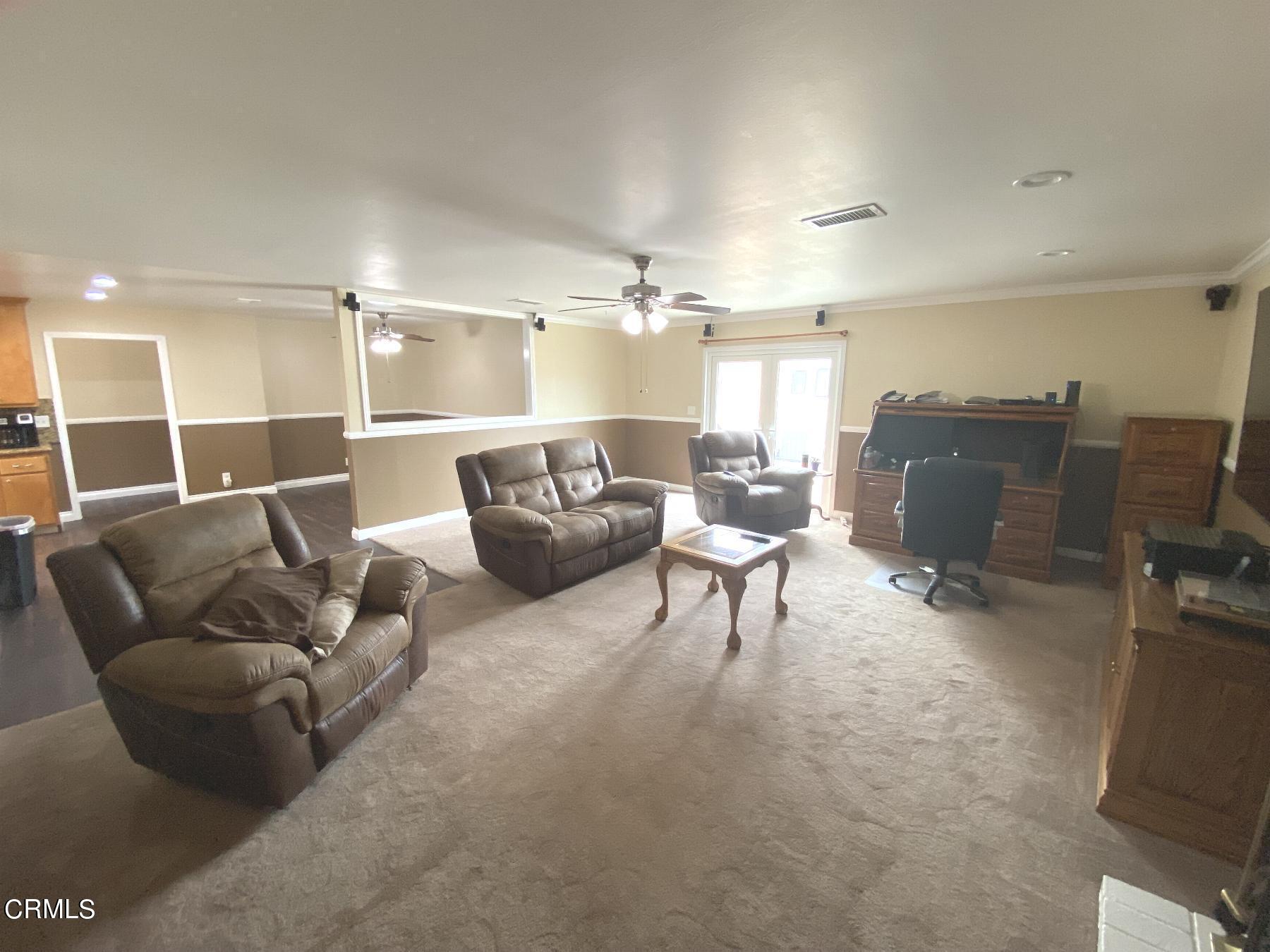 4520 Reeder Avenue Oxnard, CA 93033 - Photo 4 of 28 a living room with furniture and a flat screen tv