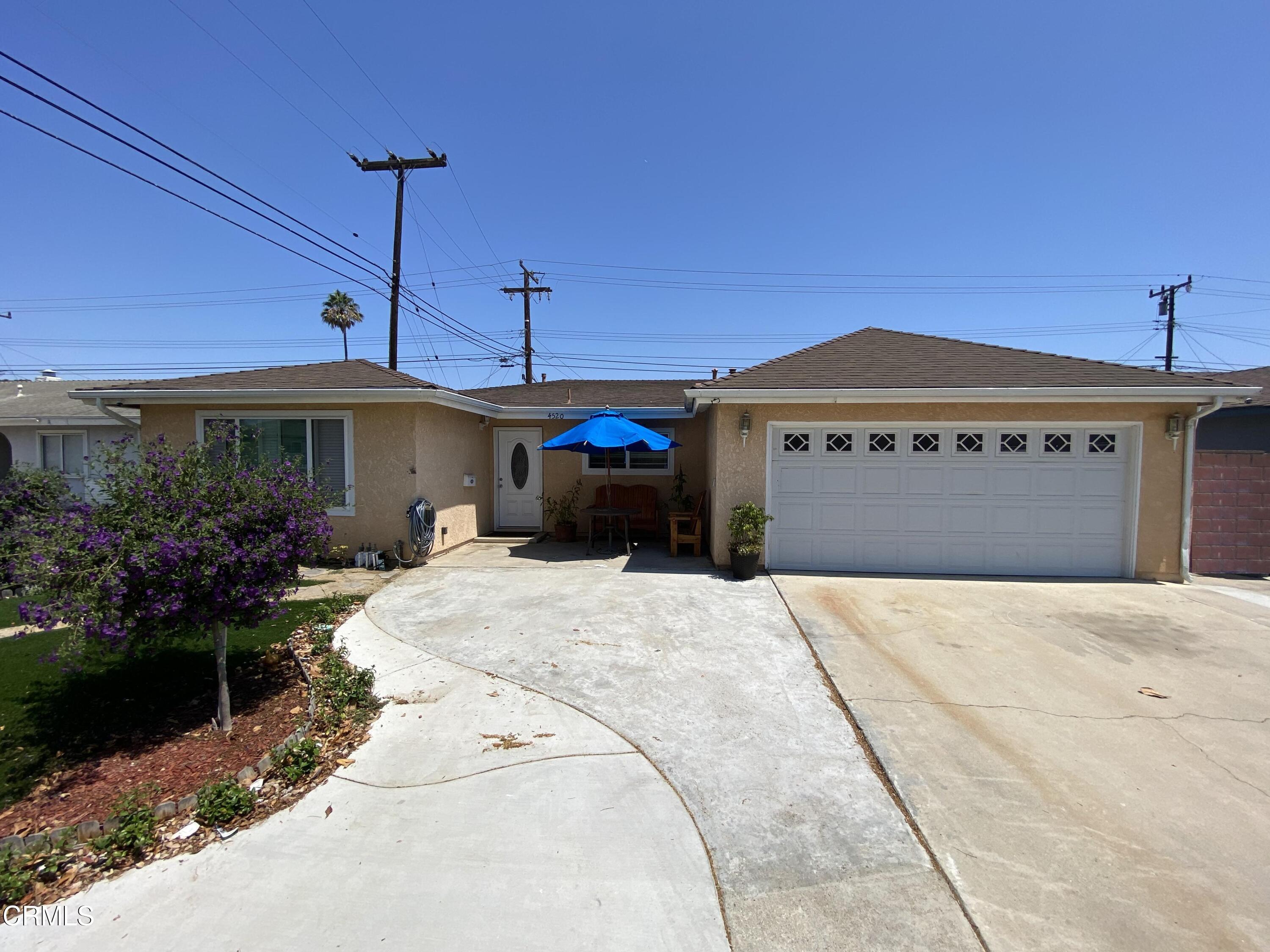 4520 Reeder Avenue Oxnard, CA 93033 - Photo 6 of 28 a front view of a house with a garden