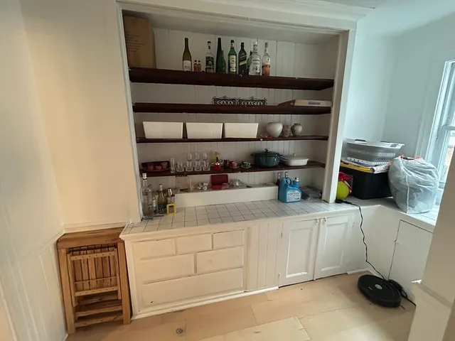 a view of a kitchen with sink and washing machine