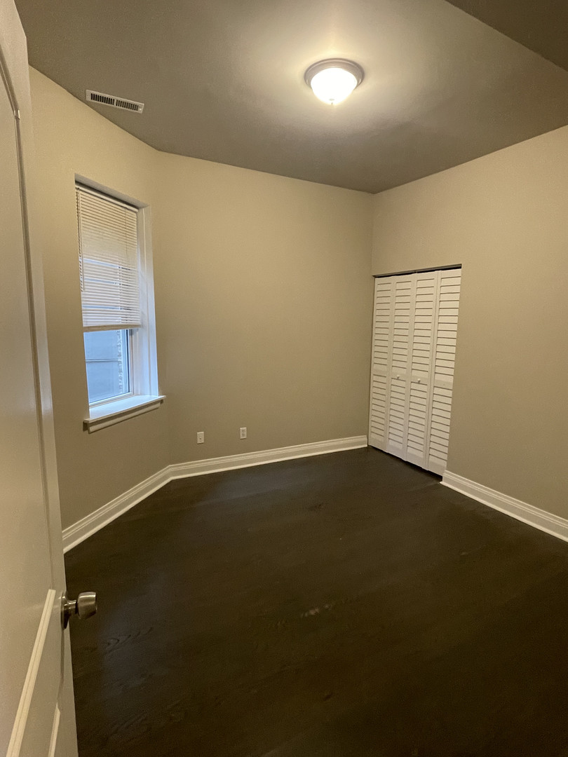 2826 West Lyndale Street, Unit 1 Chicago, IL 60647 - Photo 14 of 20 an empty room with a empty space and windows