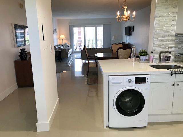 2871 North Ocean Boulevard, Unit V457 Boca Raton, FL 33431 - Photo 16 of 42 a view of livingroom with washer and dryer