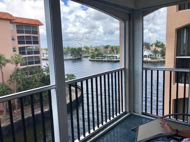 a view of a balcony with wooden floor