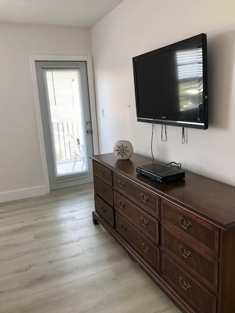 2871 North Ocean Boulevard, Unit V457 Boca Raton, FL 33431 - Photo 19 of 42 a living room with furniture and a flat screen tv
