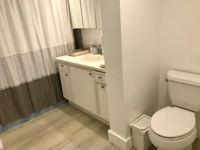 2871 North Ocean Boulevard, Unit V457 Boca Raton, FL 33431 - Photo 20 of 42 a bathroom with a sink a toilet and a window
