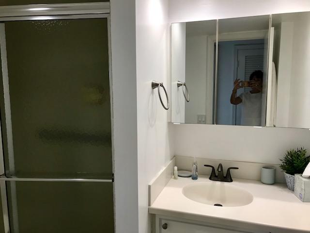 2871 North Ocean Boulevard, Unit V457 Boca Raton, FL 33431 - Photo 23 of 42 a bathroom with a sink and mirror
