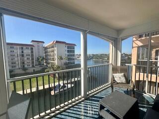 2871 North Ocean Boulevard, Unit V457 Boca Raton, FL 33431 - Photo 29 of 42 a view of a balcony with wooden floor