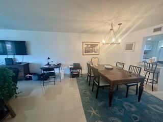 2871 North Ocean Boulevard, Unit V457 Boca Raton, FL 33431 - Photo 33 of 42 a view of a dining room with furniture and wooden floor