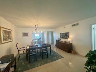 2871 North Ocean Boulevard, Unit V457 Boca Raton, FL 33431 - Photo 34 of 42 a dining room with furniture and window