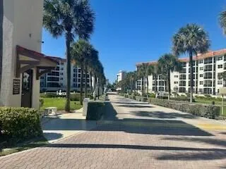 a view of swimming pool with outdoor seating and plants