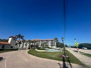 a view of a street with a building in the background