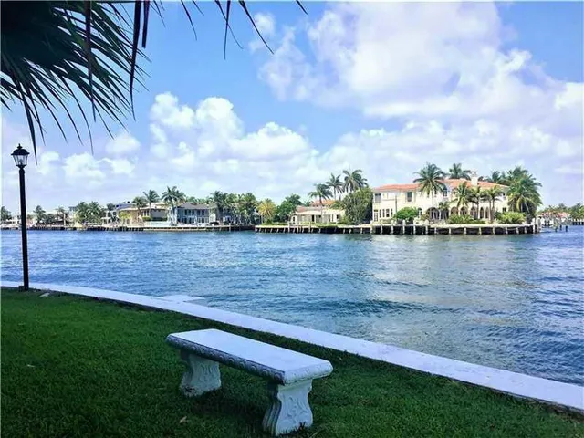 a view of a lake with a yard