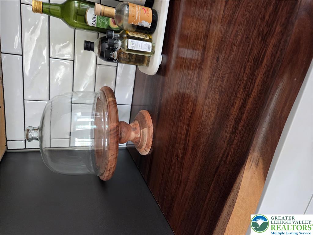 89 Short Ridge Road Albrightsville, PA 18210 - Photo 24 of 71 Rich wood countertops pair with a classic subway tile backsplash in this kitchen.