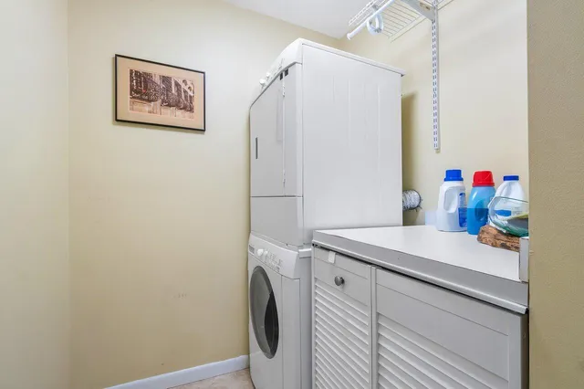 a view of a storage and utility room with a washer dryer