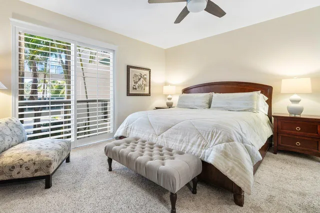 a bedroom with a bed and a couch