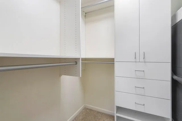 a bathroom with double sink and a mirror