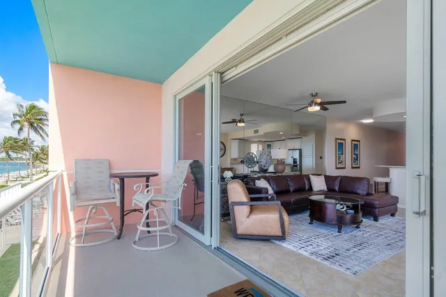 a view of a balcony with chairs