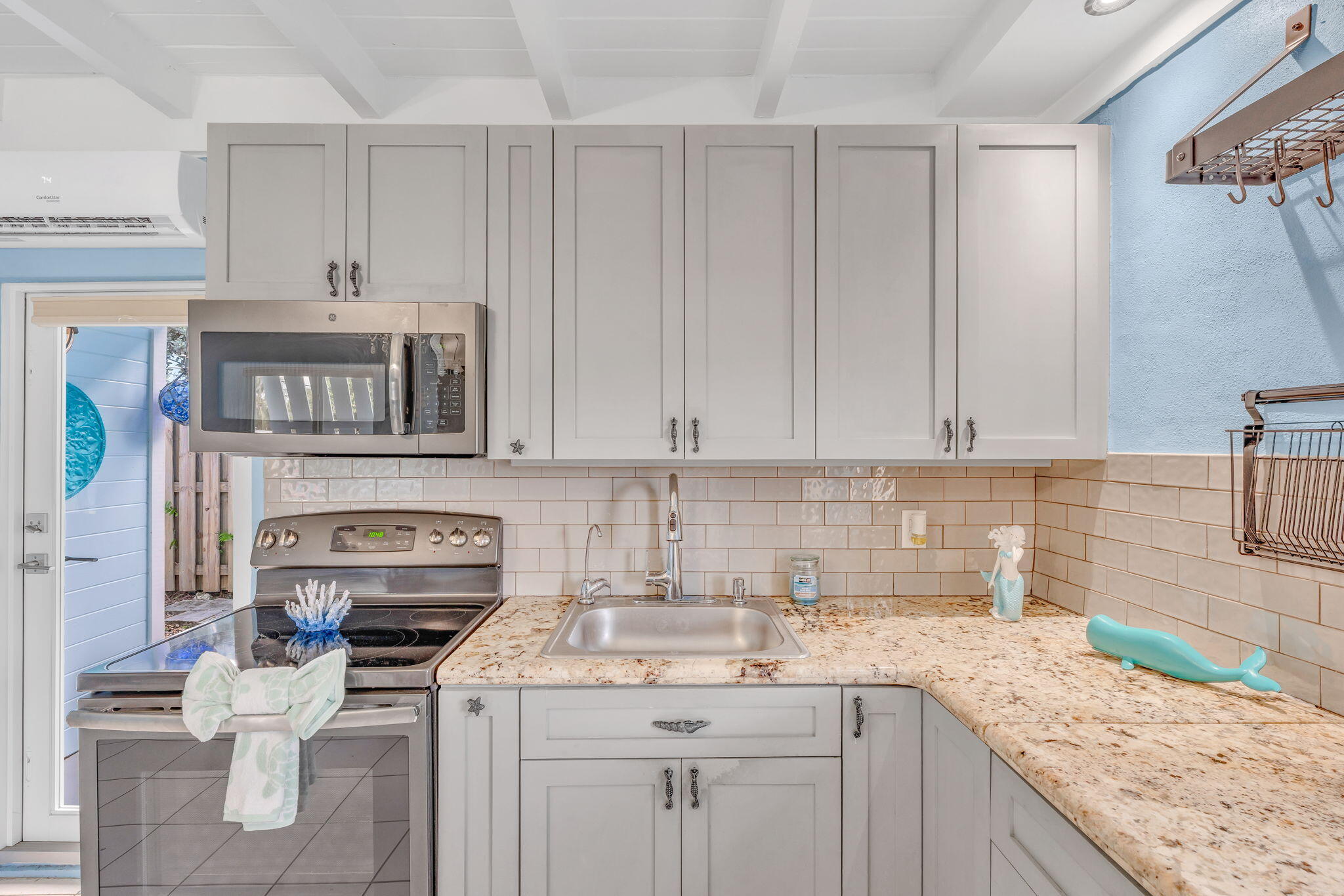 40 Pirates Drive Key Largo, FL 33037 - Photo 11 of 35 a kitchen with stainless steel appliances granite countertop a sink stove and cabinets
