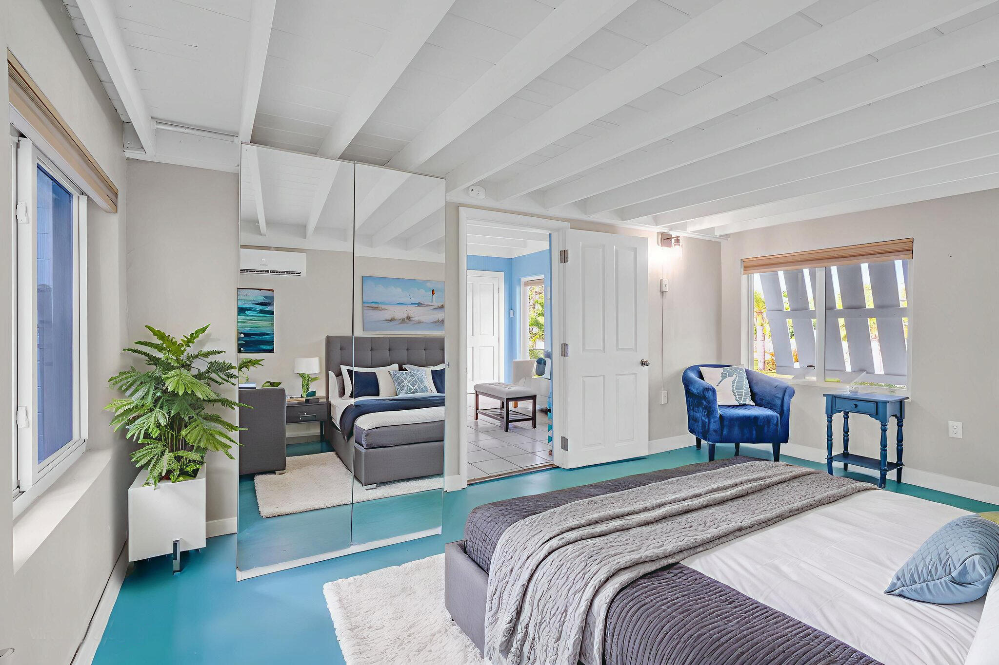 40 Pirates Drive Key Largo, FL 33037 - Photo 20 of 35 a bedroom with a balcony a bed and a couch