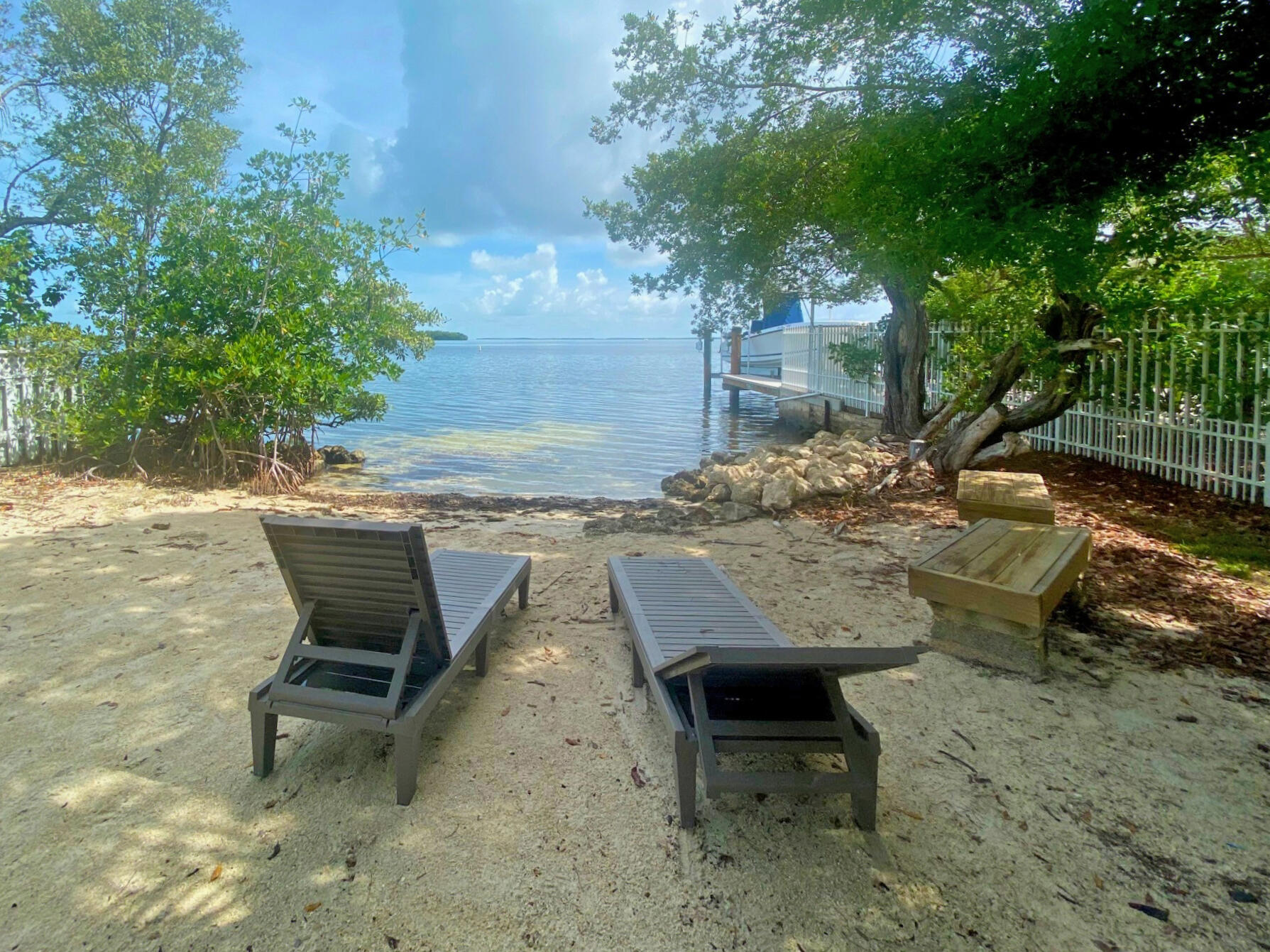 40 Pirates Drive Key Largo, FL 33037 - Photo 32 of 35 a view of a patio with table and chairs and potted plants