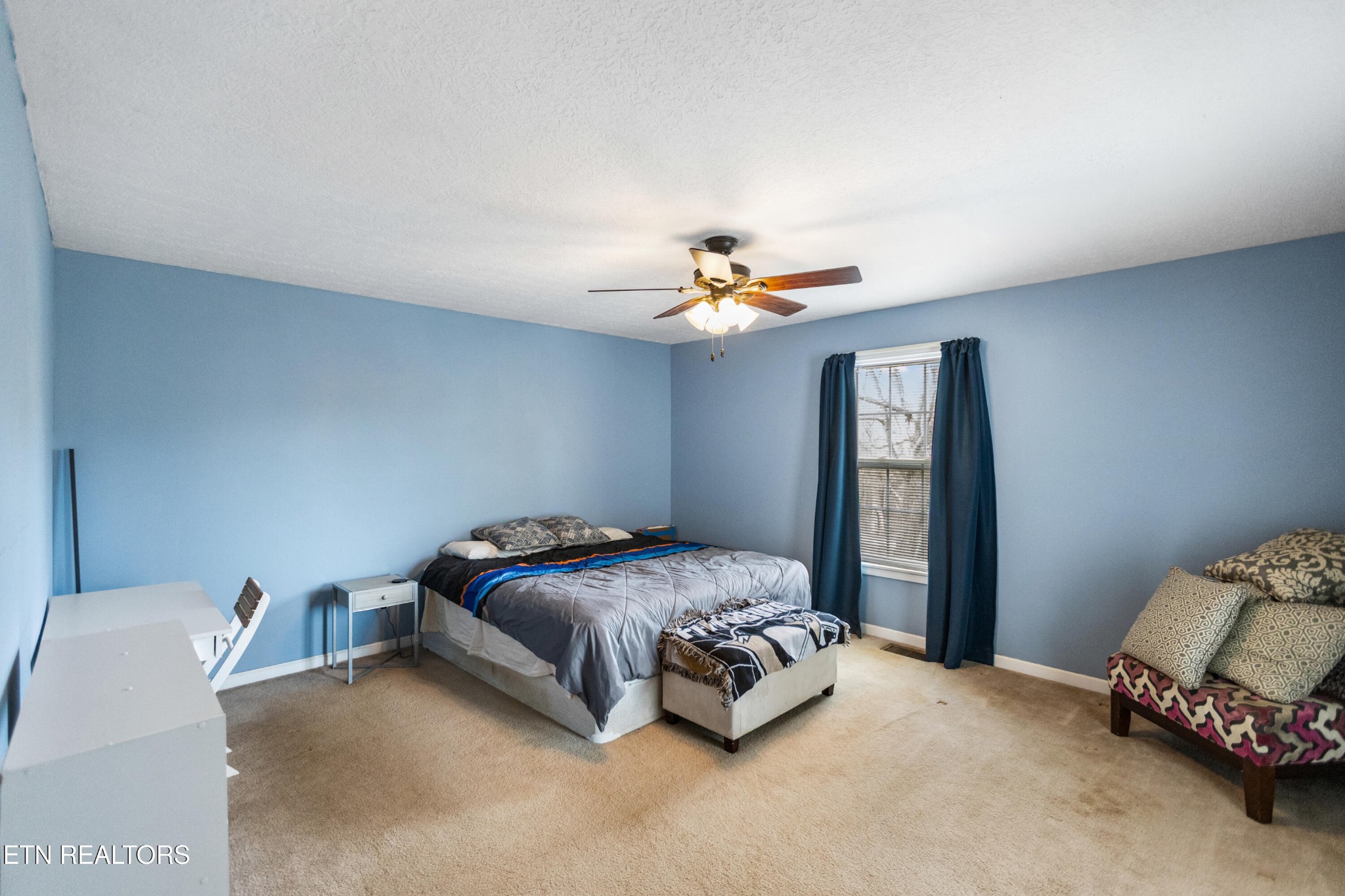 450 Emerts View Circle Seymour, TN 37865 - Photo 12 of 27 a bedroom with a bed and a chandelier