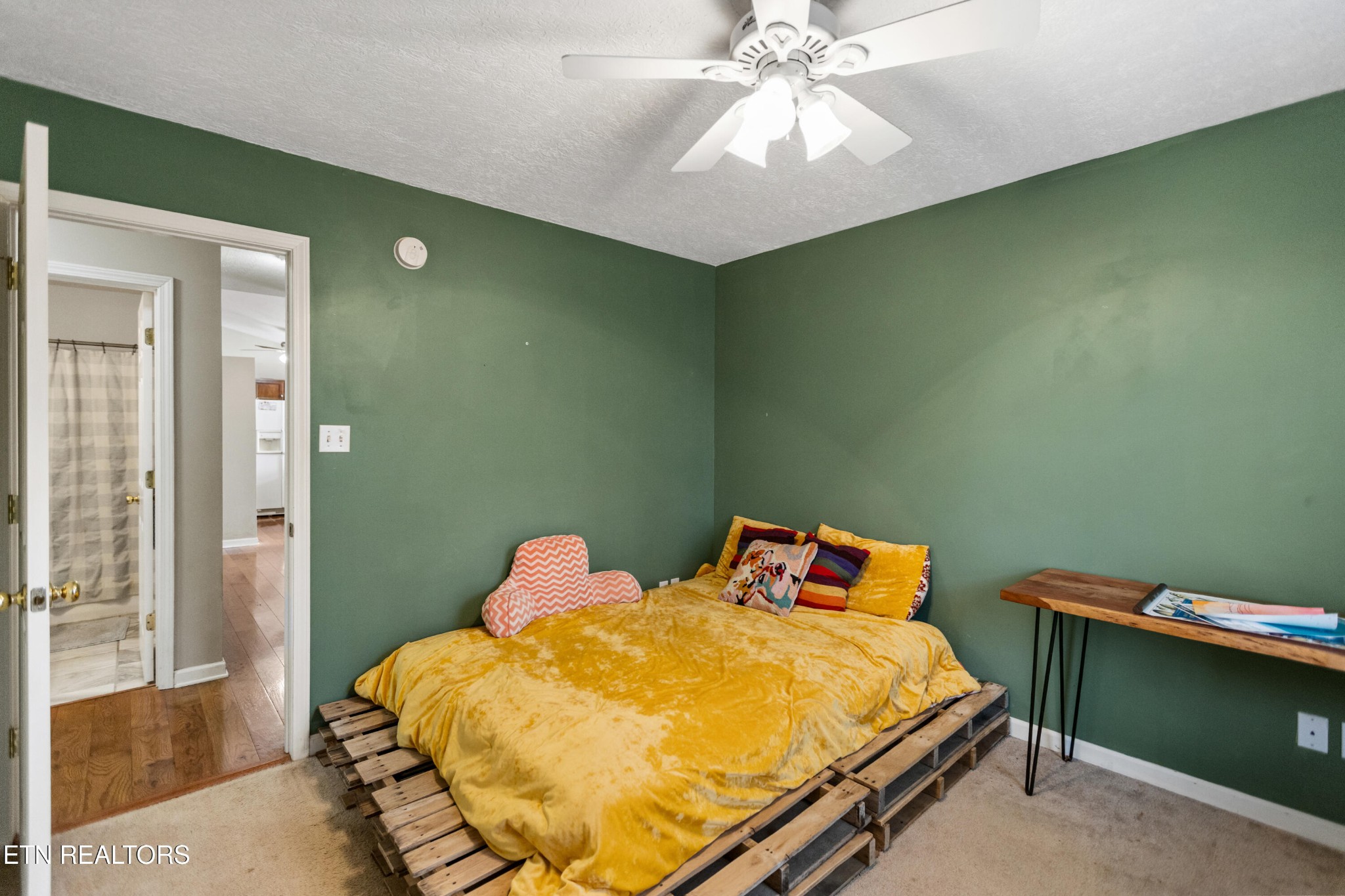 450 Emerts View Circle Seymour, TN 37865 - Photo 15 of 27 a bedroom with a bed and a chandelier