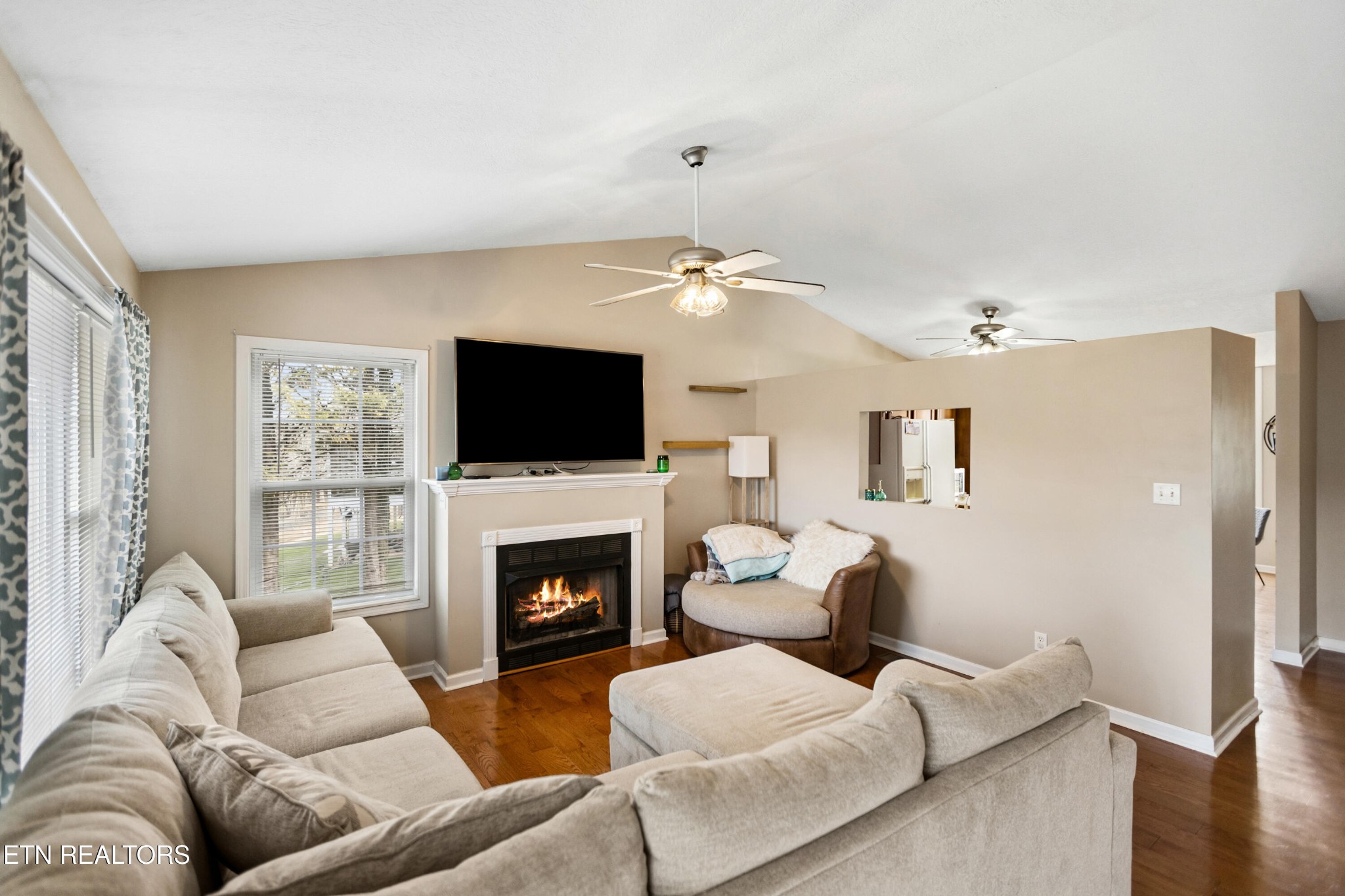 450 Emerts View Circle Seymour, TN 37865 - Photo 5 of 27 a living room with furniture a fireplace and a flat screen tv