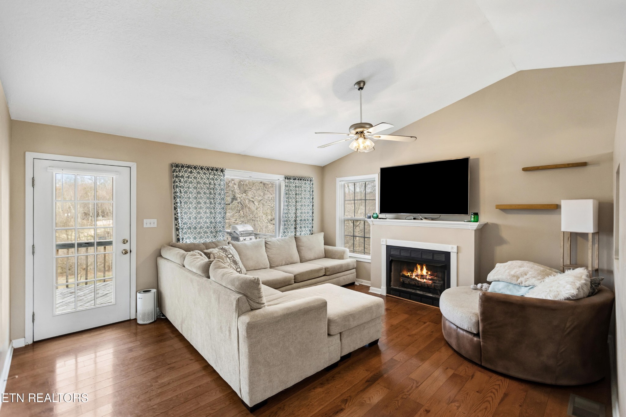 450 Emerts View Circle Seymour, TN 37865 - Photo 6 of 27 a living room with furniture a fireplace and a flat screen tv