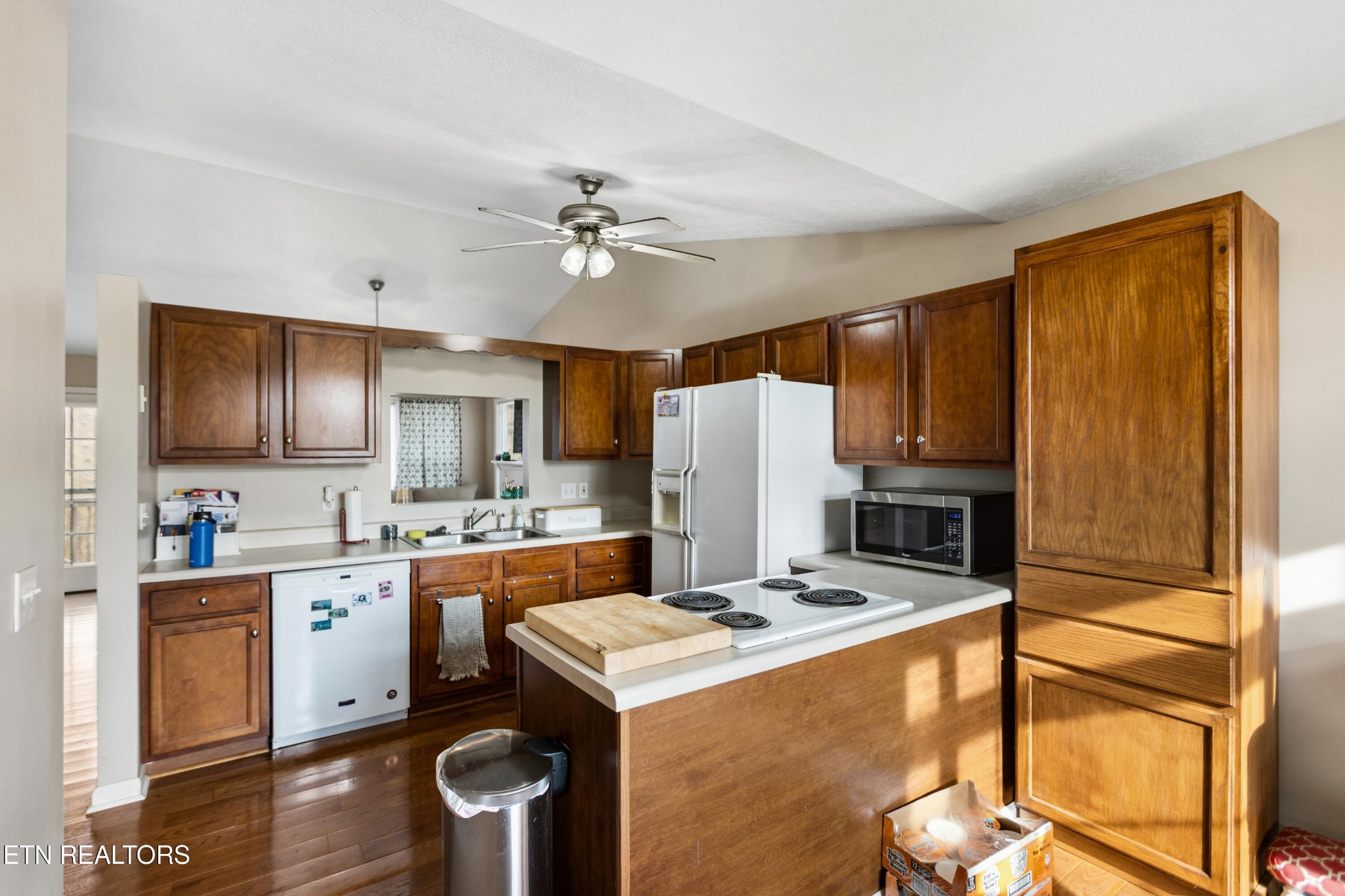 450 Emerts View Circle Seymour, TN 37865 - Photo 9 of 27 a kitchen with a stove a sink dishwasher and a refrigerator with wooden floor