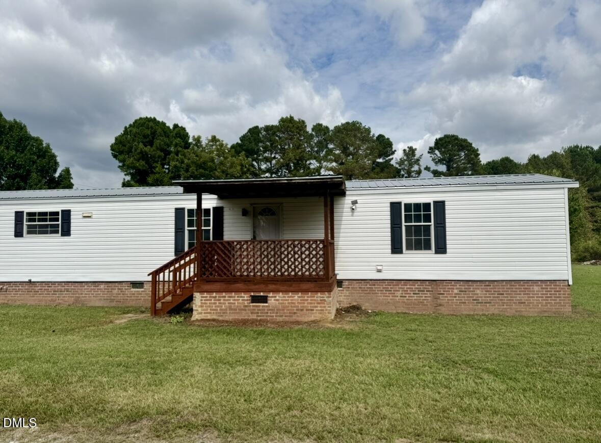 9614 Dunn Road Godwin, NC 28344 - Photo 2 of 9 a backyard of a house with lots of green space