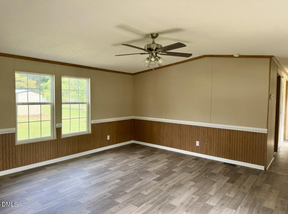 9614 Dunn Road Godwin, NC 28344 - Photo 3 of 9 an empty room with windows and fan