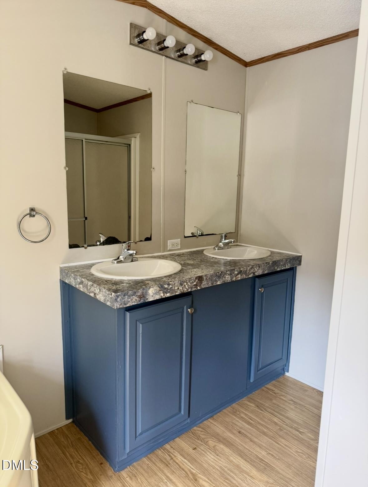 9614 Dunn Road Godwin, NC 28344 - Photo 6 of 9 a bathroom with a granite countertop sink and a mirror