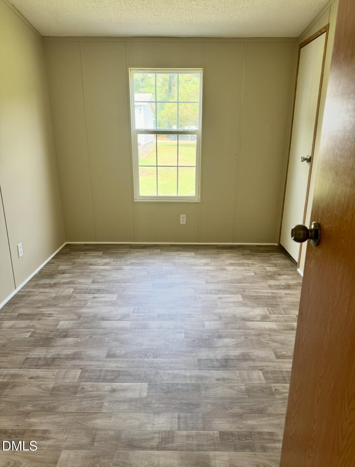 9614 Dunn Road Godwin, NC 28344 - Photo 8 of 9 a view of an empty room with a window