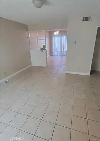 a view of a kitchen with a refrigerator