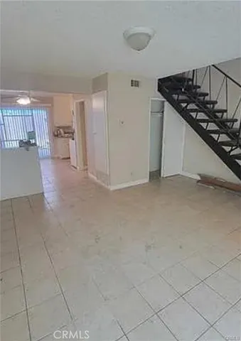 a view of a livingroom with a staircase