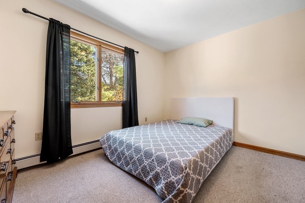 8 Hyde Street Worcester, MA 01606 - Photo 19 of 36 a bedroom with a bed and a window