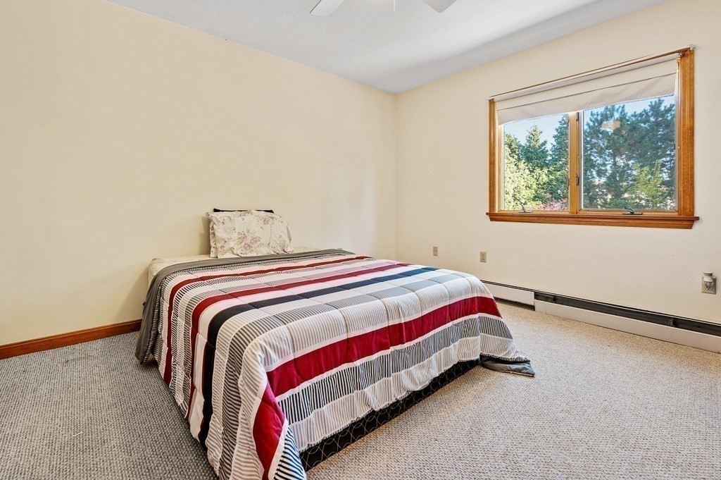 8 Hyde Street Worcester, MA 01606 - Photo 20 of 36 a bedroom with a bed and window