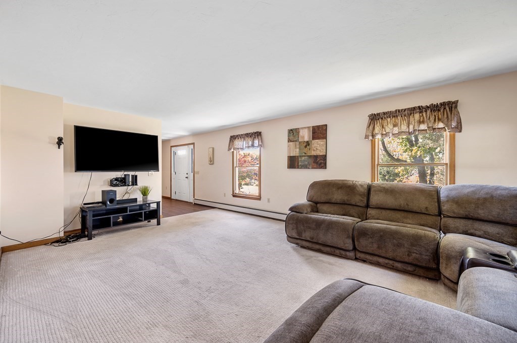 8 Hyde Street Worcester, MA 01606 - Photo 2 of 36 a living room with furniture and a flat screen tv