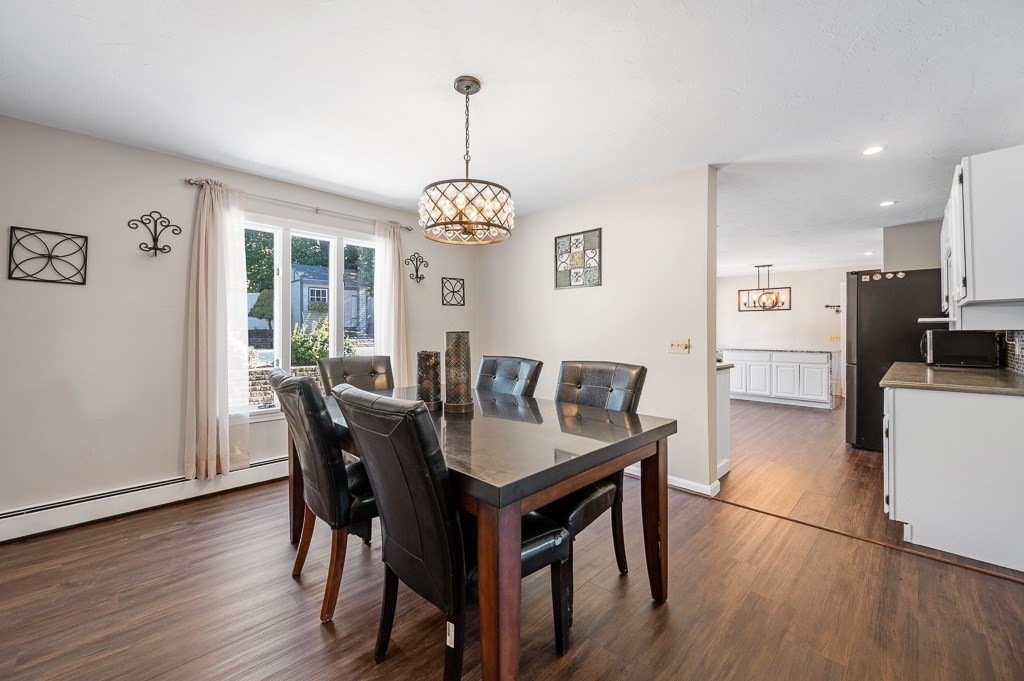 8 Hyde Street Worcester, MA 01606 - Photo 5 of 36 a view of a dining room with furniture window and wooden floor