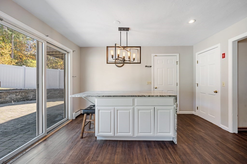 8 Hyde Street Worcester, MA 01606 - Photo 10 of 36 wooden floor in an empty room with a window