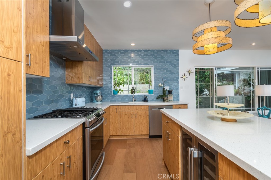3611 El Lado Drive Glendale, CA 91208 - Photo 11 of 31 a kitchen with stainless steel appliances granite countertop a sink and cabinets