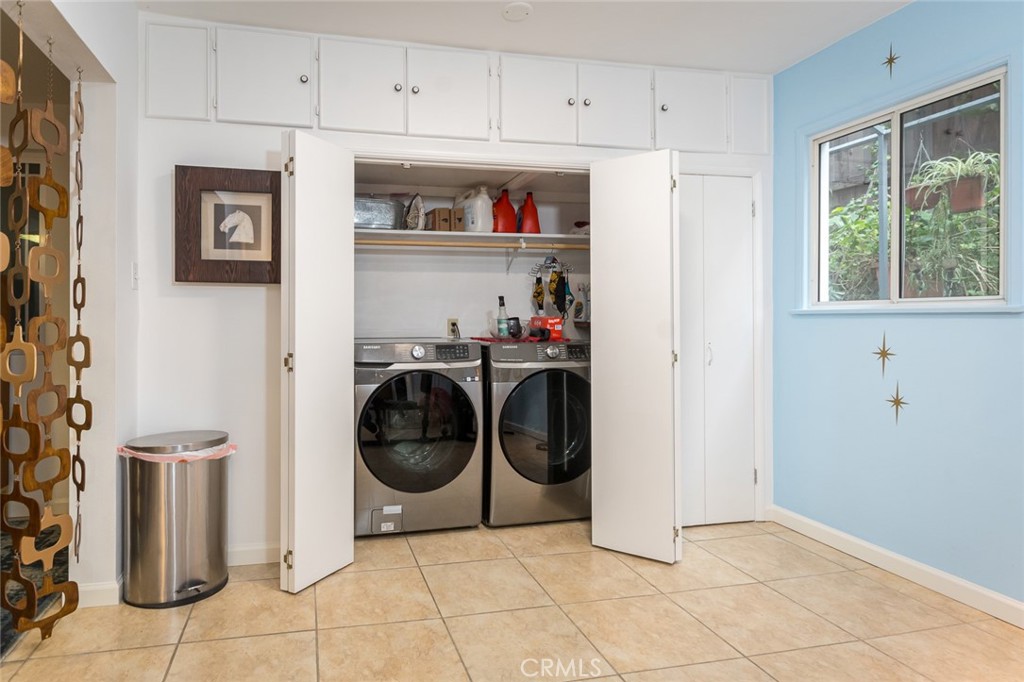 3611 El Lado Drive Glendale, CA 91208 - Photo 15 of 31 a utility room with cabinets dryer and washer